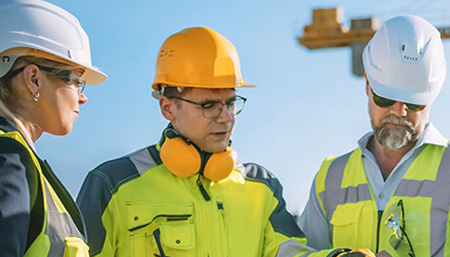 Construction team reviewing site plans