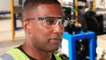 Worker in safety vest and glasses