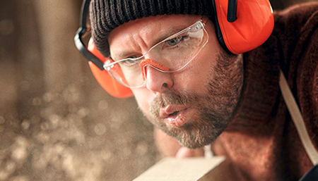 Craftsman with safety glasses and ear protection